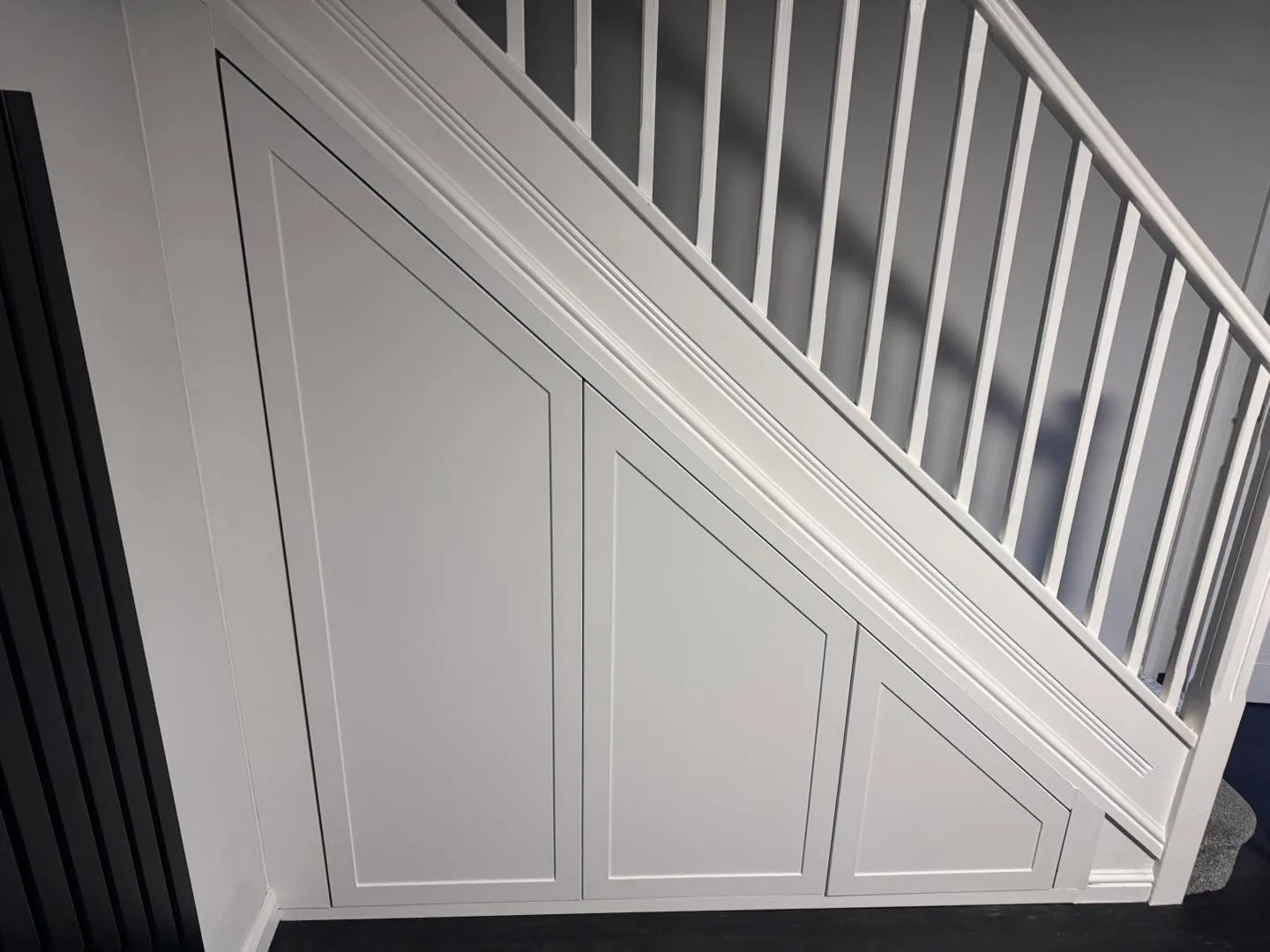 Elegant 3 door under stairs wardrobe unit custom fitted in Cardiff