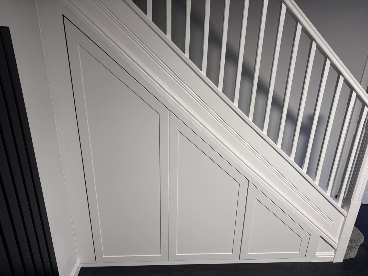 Elegant 3 door under stairs wardrobe unit custom fitted in Cardiff