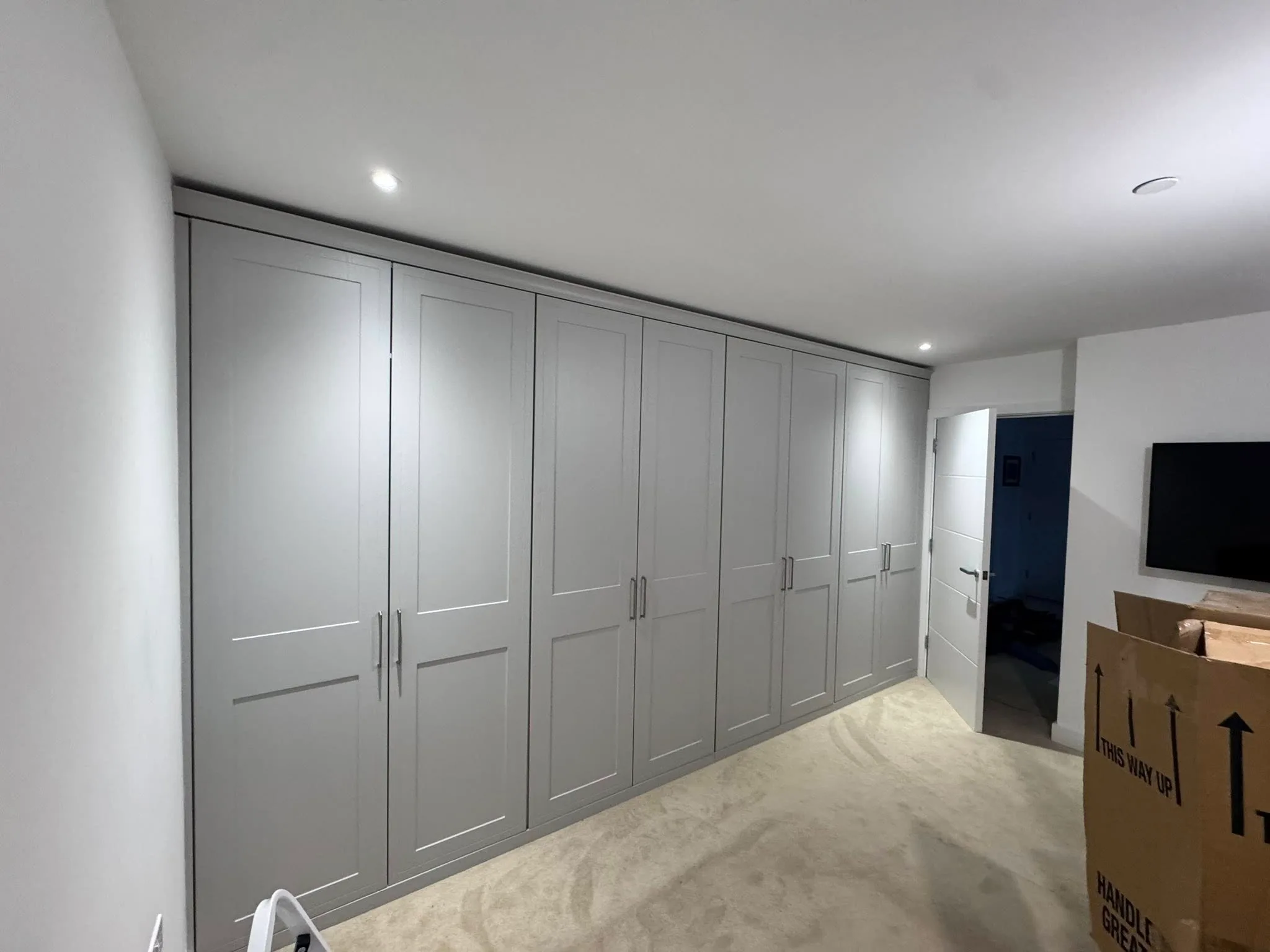 Extra large premium fitted wardrobe stretching the full width of the master bedroom in Cardiff