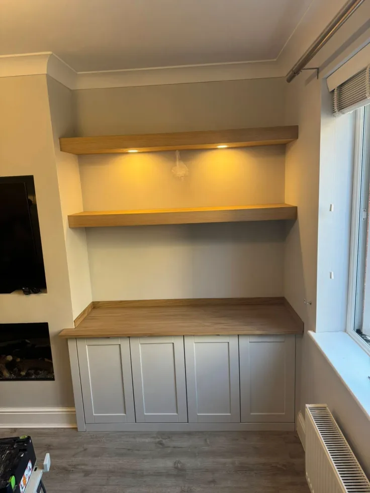Oak finished alcove base cabinets matching hardwood flooring