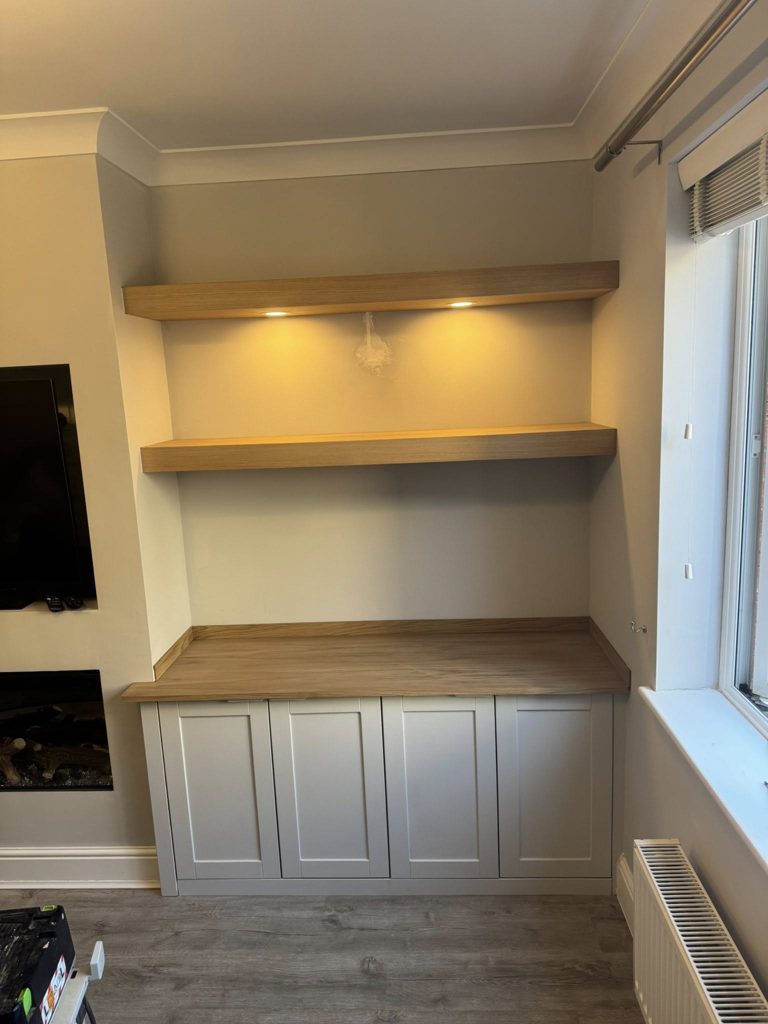 Oak finished alcove base cabinets matching hardwood flooring
