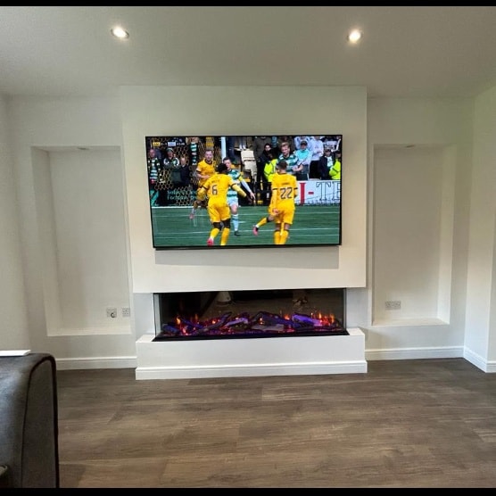 Slat panel media wall in Cardiff combining traditional woodcraft with modern tech