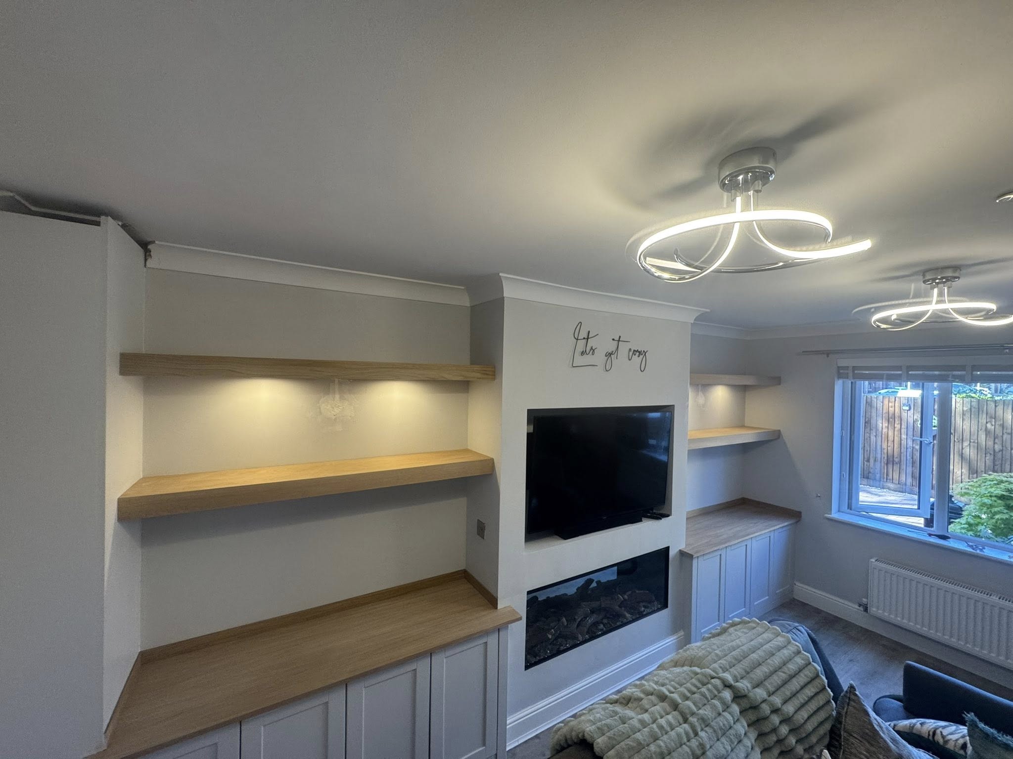 Solid oak thick floating alcove shelving installed in a period property