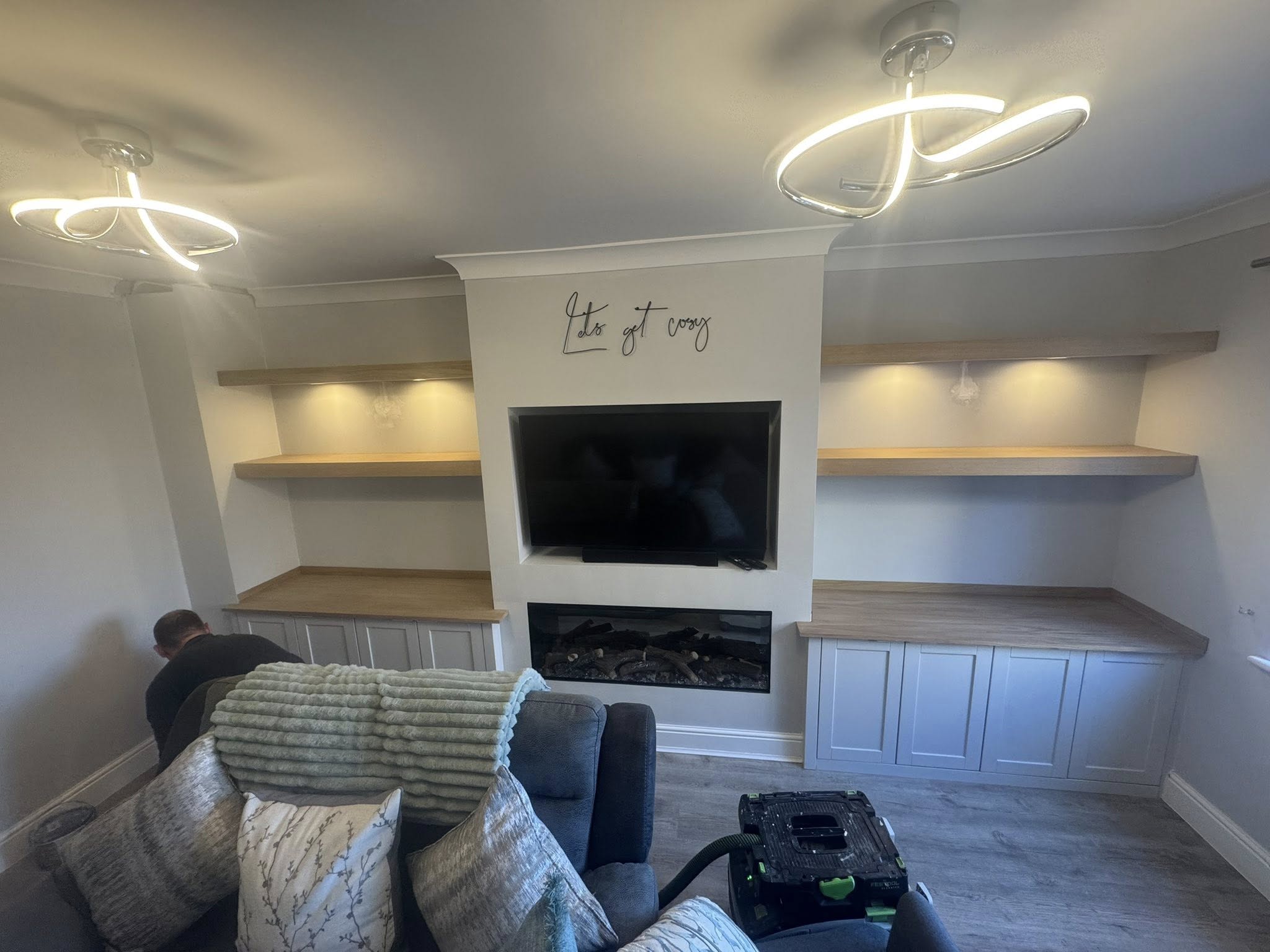 Traditional styled full-height oak alcove units framing a fireplace